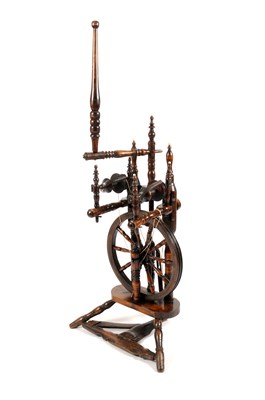 Lot 307 - A George III country oak turned spinning wheel