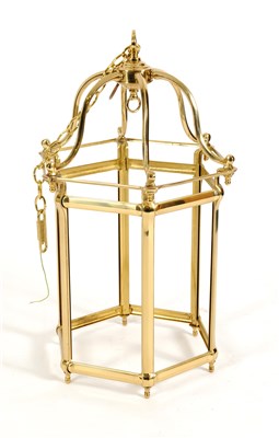 Lot 593 - A large Georgian style brass framed hexagonal porch / ceiling lantern