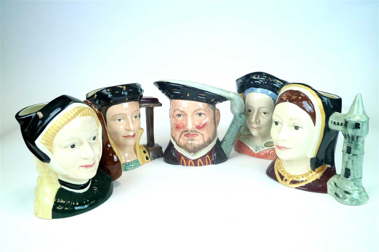 Lot 416 - Royal Doulton Henry VIII and six wives toby jugs