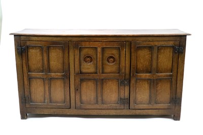 Lot 477 - A panelled oak sideboard