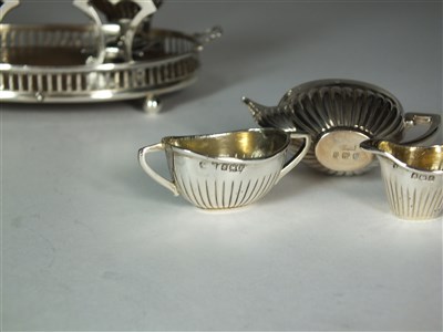 Lot 11 - An Edwardian silver miniature tea service