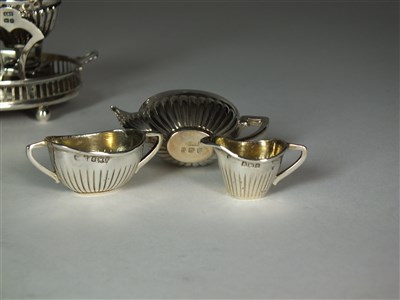 Lot 11 - An Edwardian silver miniature tea service