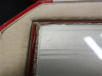 Lot 105 - A cased silver and guilloche enamel cigarette case and compact set