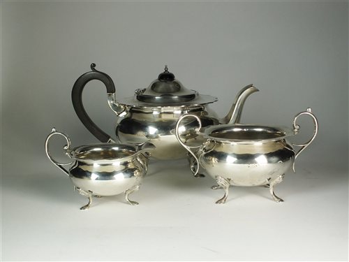 Lot 128 - A three piece silver tea service