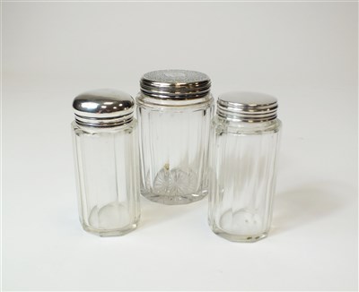 Lot 260 - Three silver topped jars