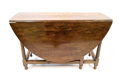 Lot 437 - A 19th century oak gateleg dining table