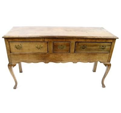 Lot 482 - A small George III oak sideboard