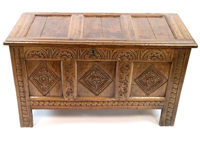 Lot 983 - An 18th century carved panelled country oak coffer