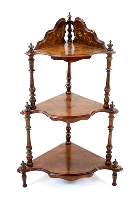 Lot 484 - A late Victorian walnut veneered floor-standing three tier corner whatnot