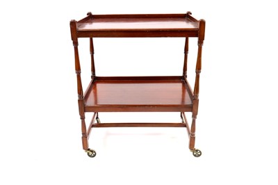 Lot 487 - A stained mahogany two-tier tea trolley