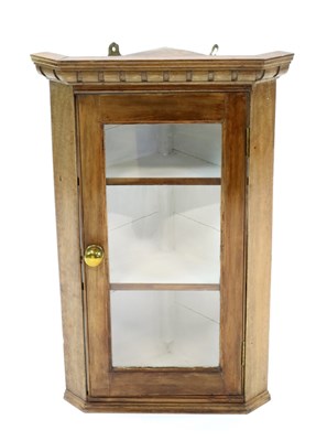 Lot 1022 - A small Edwardian pale oak and pine wall-hanging corner cupboard