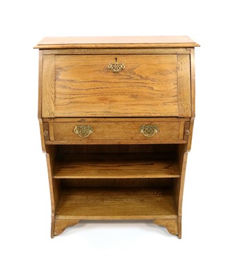 Lot 1001 - An early 20th century pale oak hall / student's bureau