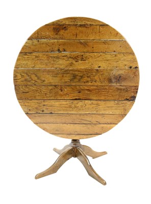 Lot 907 - A late 19th century planked oak snap-top table