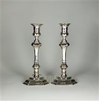 Lot 103 - A near pair of silver mounted candlesticks