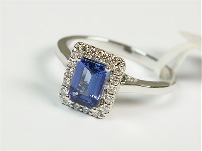 Lot 290 - An 18ct white gold tanzanite and diamond cluster ring