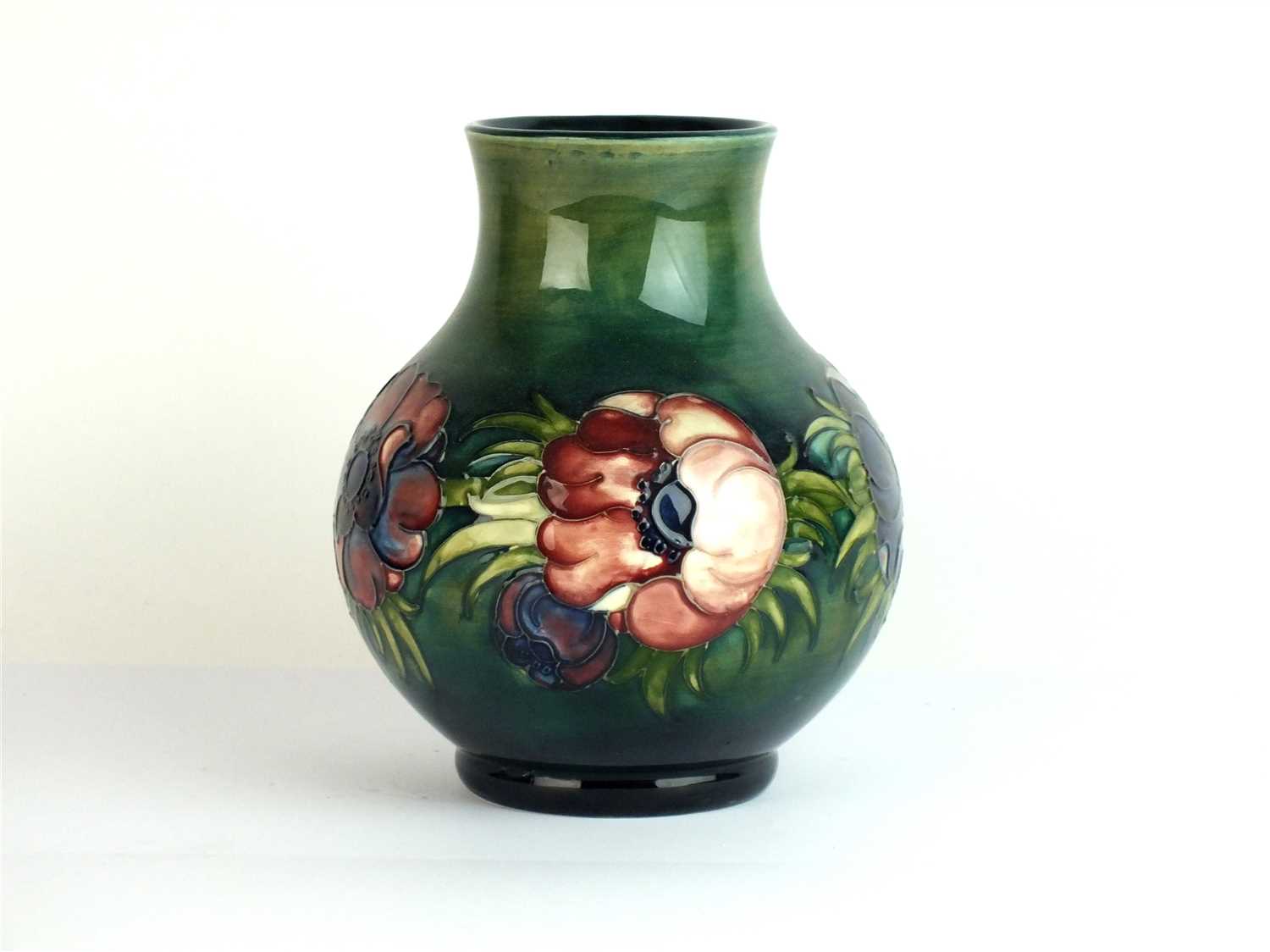 Lot 437 - A Moorcroft green ground vase