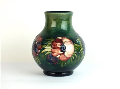 Lot 437 - A Moorcroft green ground vase