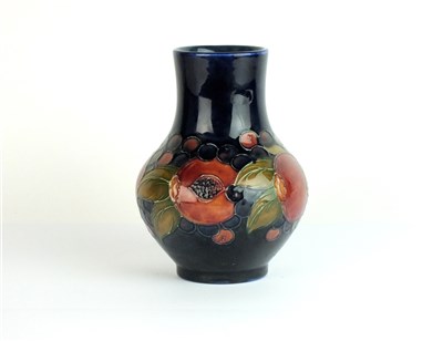 Lot 438 - A Moorcroft vase in Pomegranate pattern