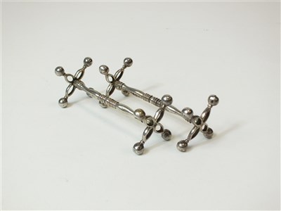 Lot 275 - A pair of silver knife rests