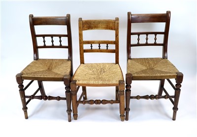 Lot 895 - Four associated rush seated dining chairs