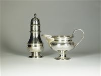 Lot 6 - A silver cream jug and sugar caster