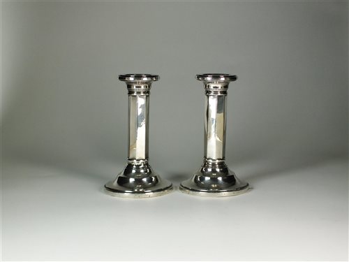 Lot 20 - A pair of silver mounted candlesticks