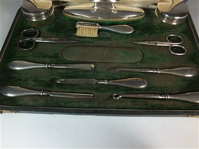 Lot 82 - A cased silver mounted travelling vanity set