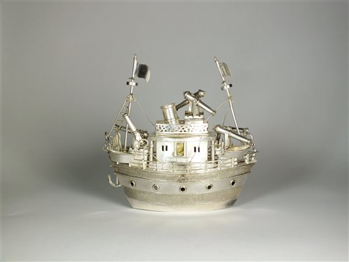 Lot 68 - A white metal model of a ship