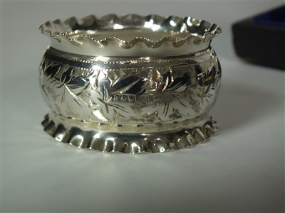 Lot 120 - A cased set of six silver napkin rings