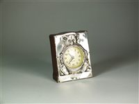 Lot 24 - A silver mounted timepiece