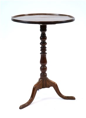 Lot 947 - A George III oak tray top tripod table