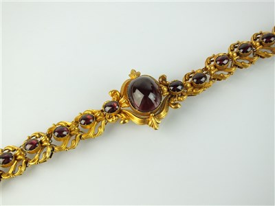 Lot 178 - A mid-19th century cabochon garnet bracelet