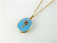 Lot 181 - A turquoise enamel, seed pearl and garnet crucifix pendant locket