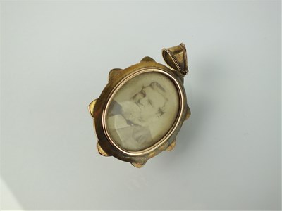 Lot 175 - A Victorian split pearl and enamel locket pendant