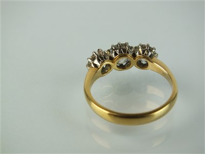 Lot 171 - An 18ct gold three stone diamond ring