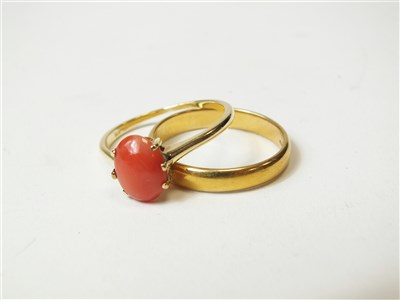 Lot 306 - A coral ring and a 22ct gold wedding band