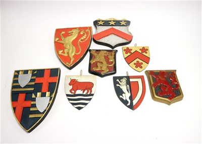 Lot 358 - A collection of fourteen early 20th century decorative wall hanging armorial shields