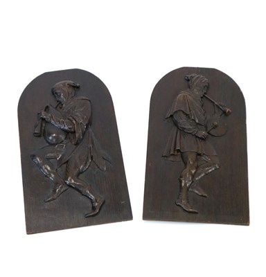 Lot 353 - A pair of Warwick school carved oak panels