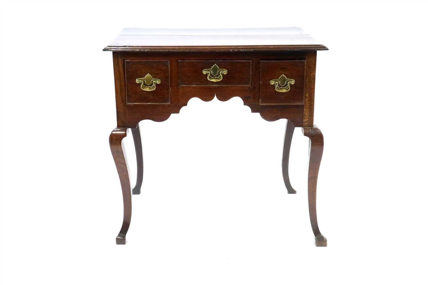 Lot 844 - A George III oak lowboy