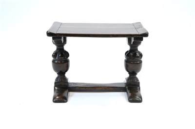 Lot 1010 - A small old English style stained oak twin baluster bench / stool