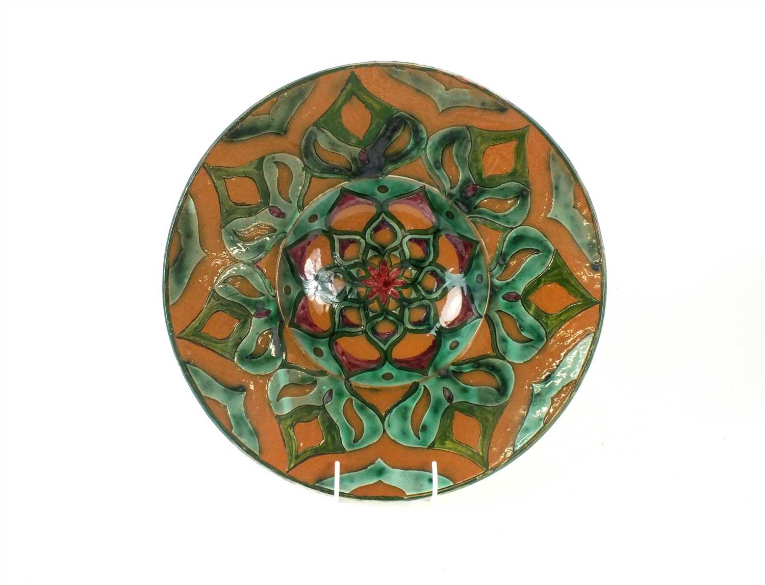 Lot 91 - A Della Robbia Art Pottery charger by Liz Wilkins