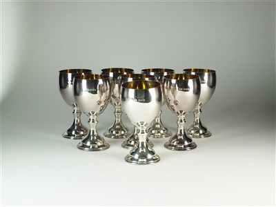 Lot 213 - A set of eight silver goblets