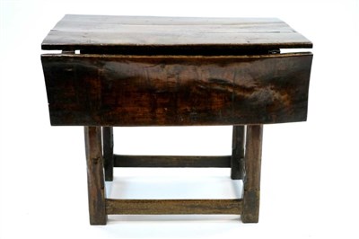 Lot 1015 - A small early English oak side table