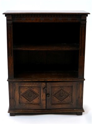 Lot 969 - An old English style oak bookcase with cupboard base