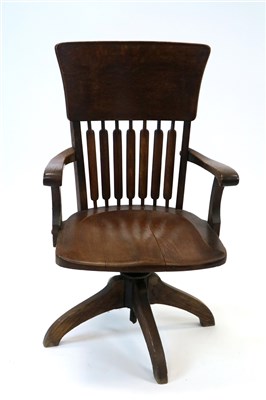 Lot 870 - An Edwardian oak spinning office chair