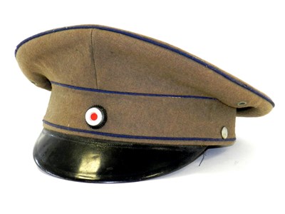 Lot 414 - A post-war West German visor cap