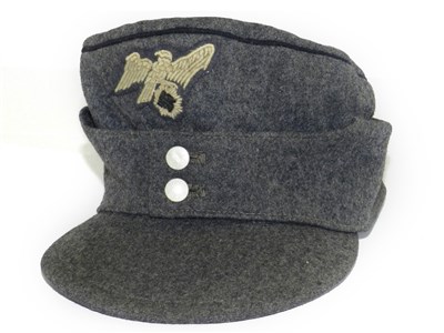 A visor cap for Sonderführer of the army in officer rank maker Erel, Berlin  Late private purchase piece in field-grey gabardine, grey trim band and  piping, golden-yellow silk liner with cap trapezoid (