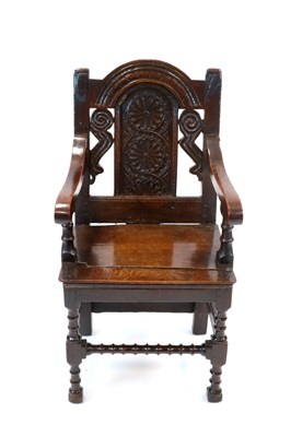 Lot 827 - An 18th Century country oak armchair