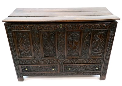 Lot 899 - A large late 18th century oak mule chest (later carved)