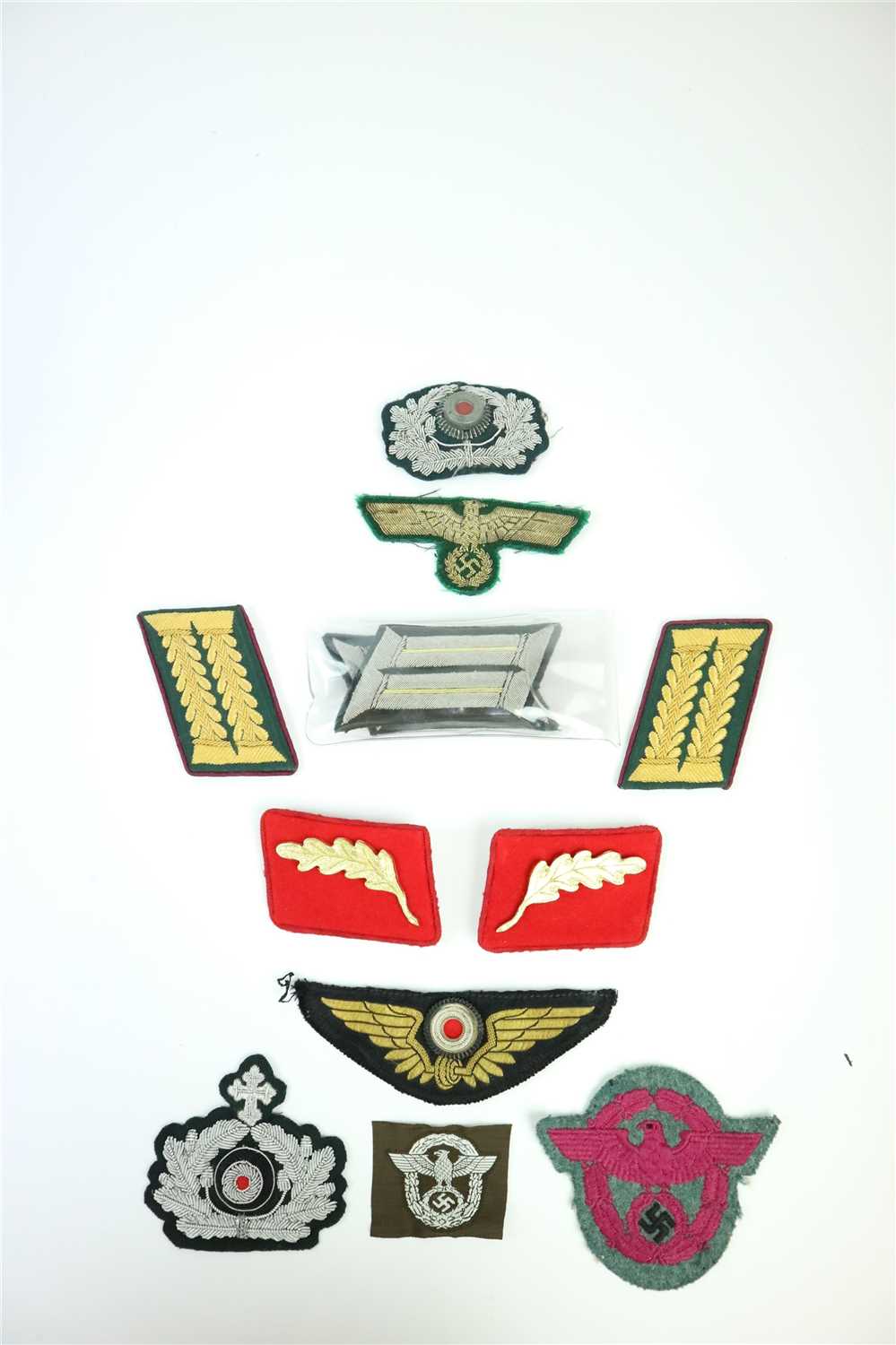 Lot 493 - A selection of German WW2 and later cloth insignia including a pair of Indanturrat Army Administration shoulder tabs